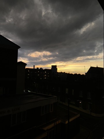 An image taken from a balcony to capture the sunset.