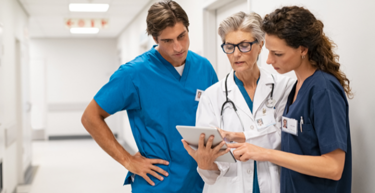 Nurses and doctors discussing a report