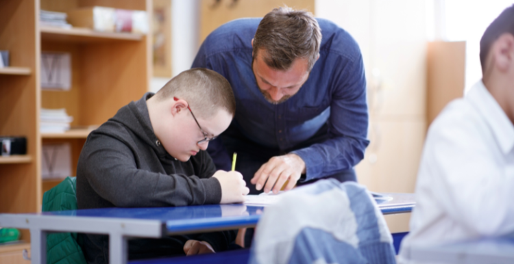 A teacher supporting a student with a learning disability