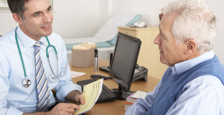 A picture of a doctor talking with a patient during an appointment.