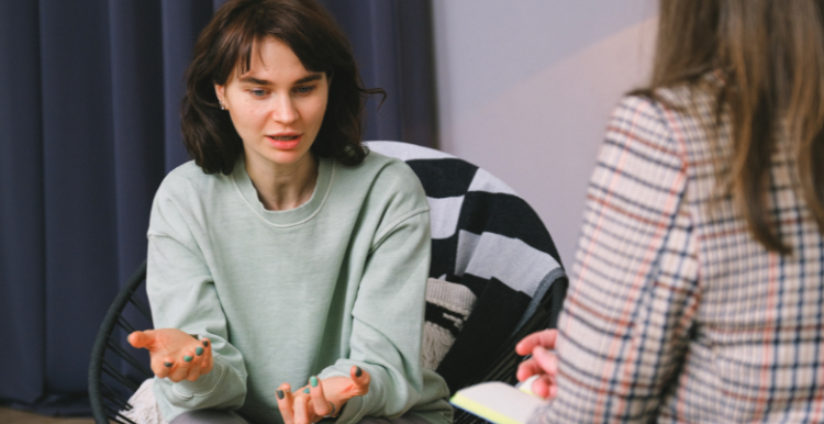 A woman talking to a psychiatrist. 