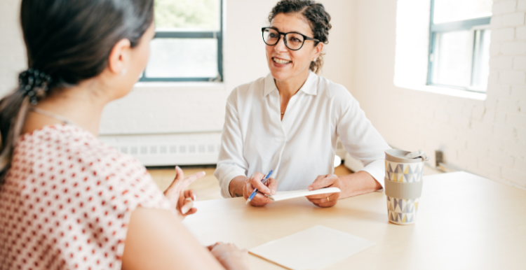 A healthcare professional offering lifestyle advice to a young person.