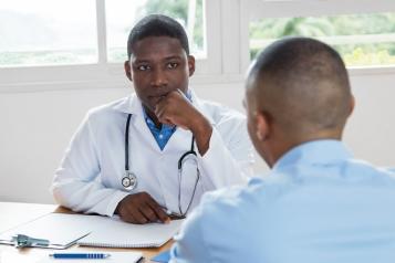 A medical professional speaking to a patient.